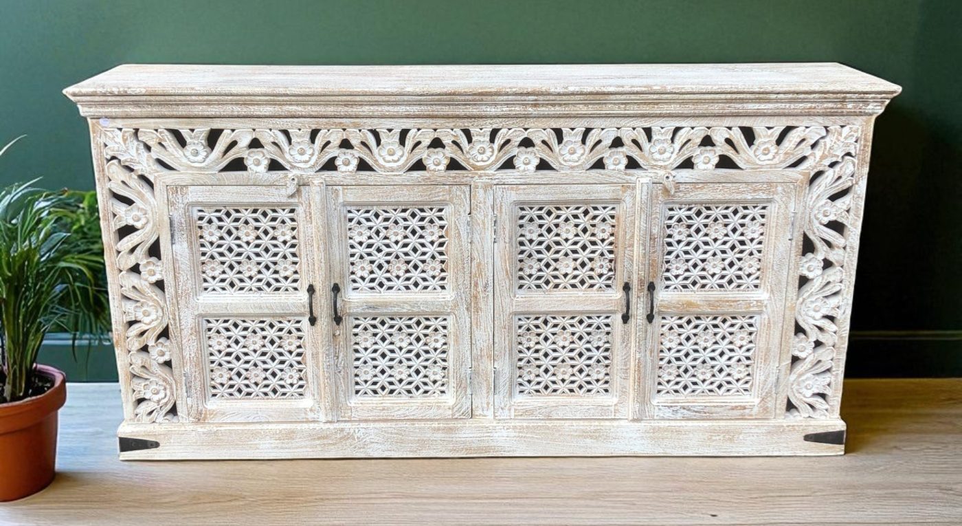 This stunning floral jali sideboard showcases exquisite craftsmanship, featuring intricately hand-carved floral and fretwork door panels that create a breathtaking piece for any space.